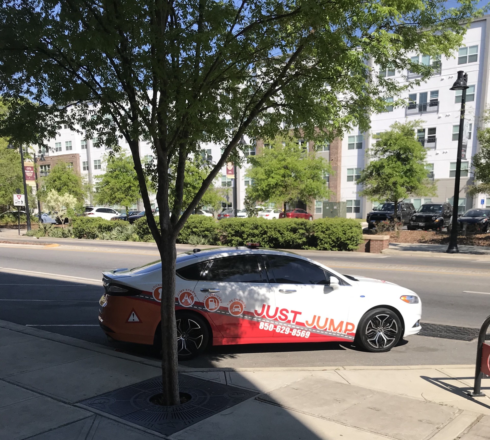 Just Jump USA® service car parked on a local street